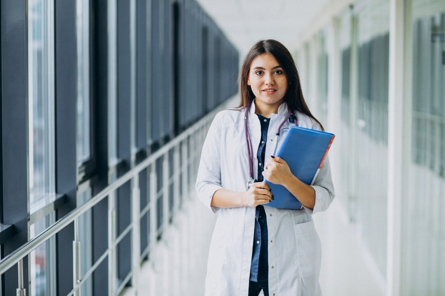 attractive-female-doctor-standing-with-documents-hospital